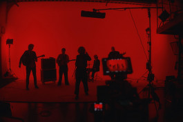 Julius Oppermann as Gaffer on Set for a Music Band. 